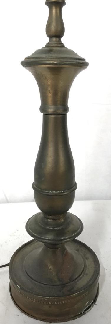 Gold Toned Brass Table Lamp: Table lamp is gold toned and brass. Piece includes finial. Table lamp, brass lamp, Side Table Lamp, End Table Lamp. Measures approx 27 inches tall 5 inches wide at base. 6