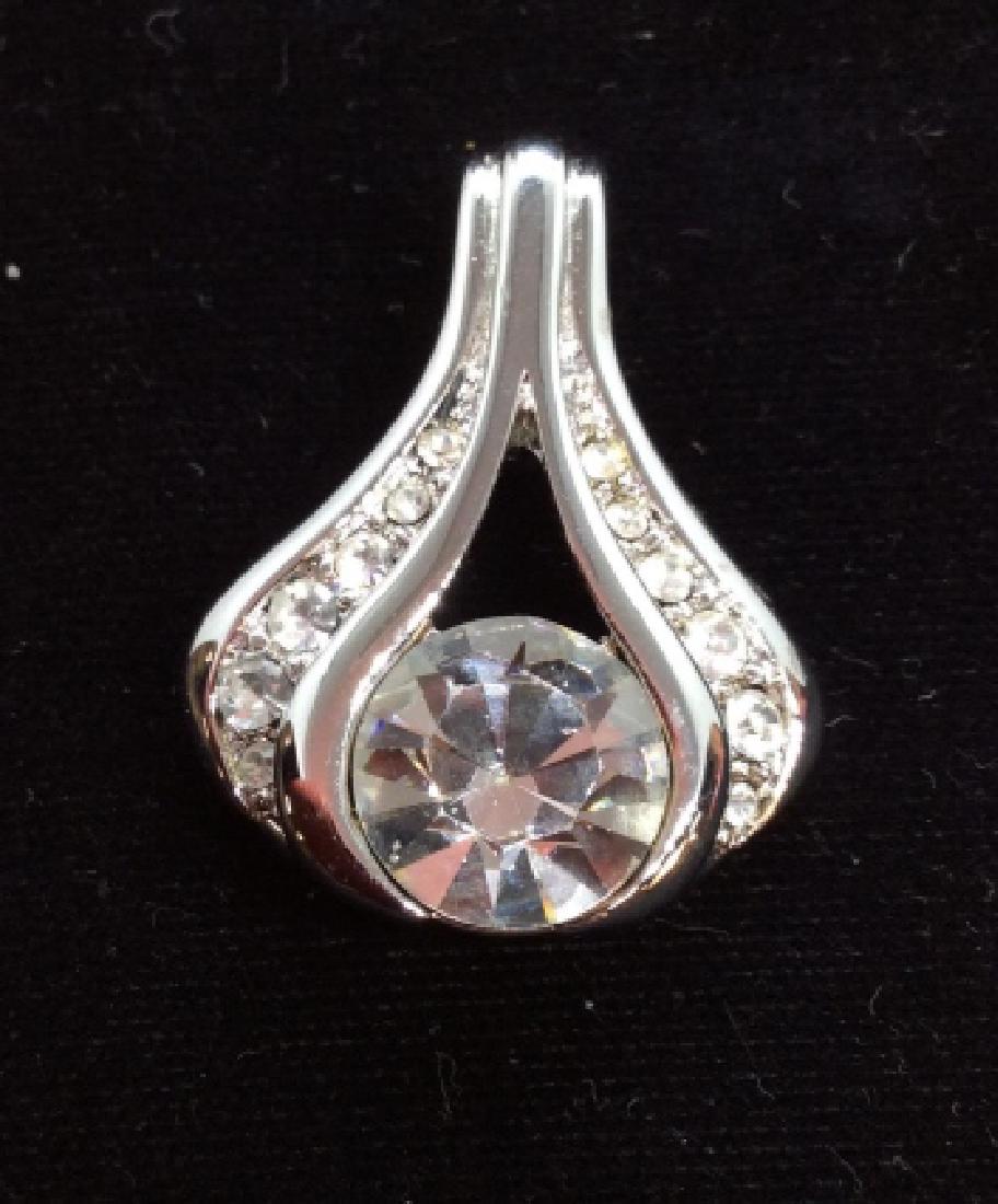 Monet Rhinestone Pendant: Women’s rhinestone encrypted silver toned metal pendant charm, measures app 1 in long . Women’s vintage estate jewelry, statement jewelry, vintage costume jewelry fashion accessory, wearable acces