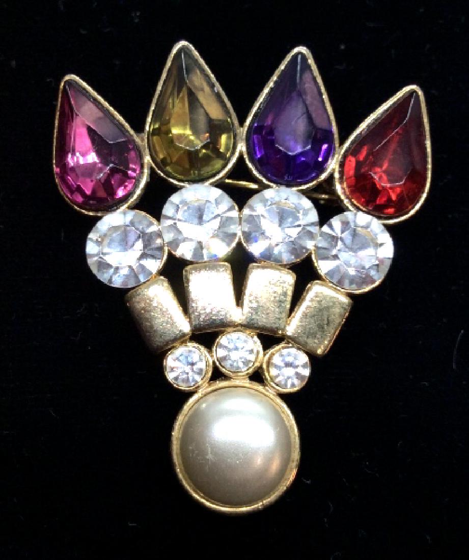 Rhinestone brooch pin: Multi colored brooch pin with rhinestones and pearl style cabochon, measures app 2 in long . Women’s vintage estate jewelry, statement jewelry, vintage costume jewelry fashion accessory, wearable ac