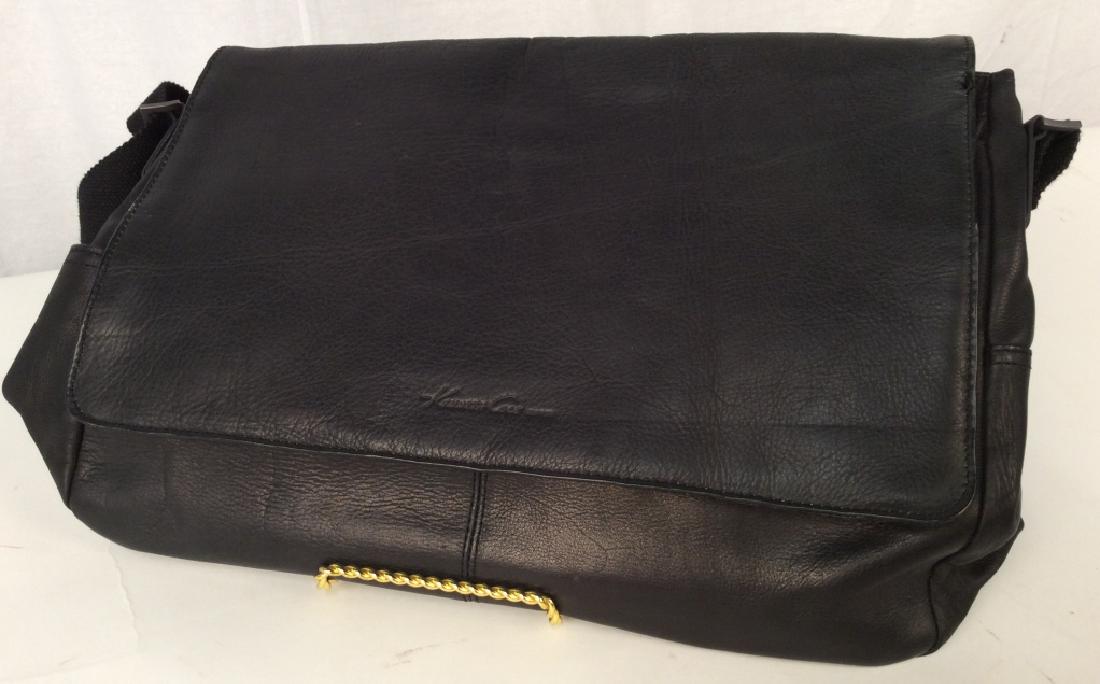 KENNETH Cole Black Leather Shoulder Bag: KENNETH Cole Black Leather Shoulder Bag, 17 in x 12 in, good condition, original tags, Calf skin with clothe interior, flap embossed with Kenneth Cole, possibly a computer bag, fabric adjustable shoul