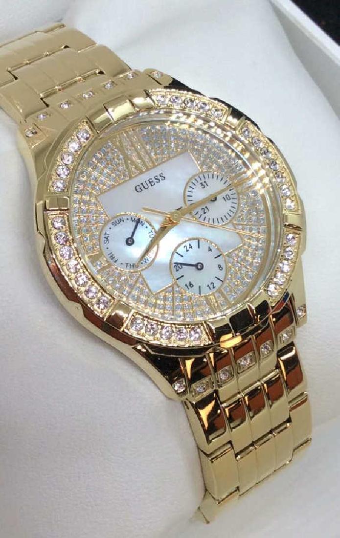 Guess Ladies Wristwatch: With original white toned leather fabric style gift box. Not tested measures app 3 in in diameter . Women’s vintage estate jewelry, statement jewelry, vintage costume jewelry fashion accessory, wear