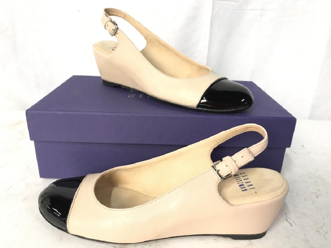 STUART WEITZMAN Black & Cream Toned Women’s Heels: Soles of heels read STUART WEITZMAN. Heels are cream toned with black toned heels. Possibly genuine leather. Heels are 2 inches high and size 6.5. Includes original box. Heels have some wear. Fashion