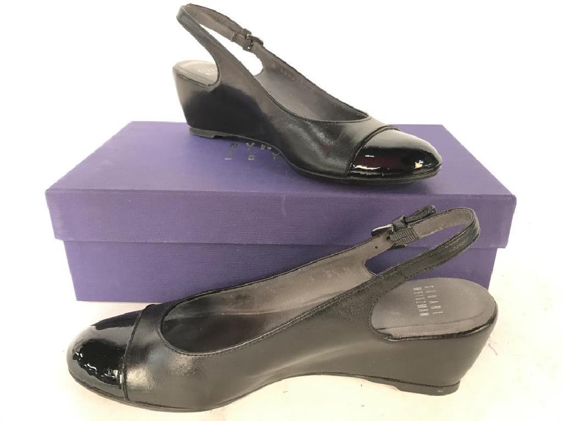 Pair Black Toned STUART WEITZMAN Women’s Heels: Soles of Heels read STUART WEITZMAN. Heels are size 6.5 and have 2 inch high heels. Possibly genuine leather. Includes original box. Contains some wear. Undersides read MADE IN SPAIN. Fashion accessor