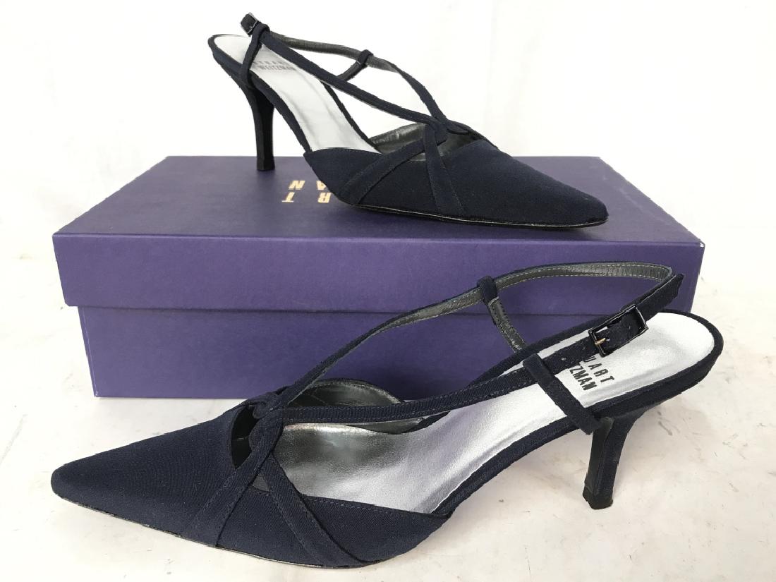 Pair Navy Toned STUART WEITZMAN Women’s Heels: Soles of heels read STUART WEITZMAN. Heels are navy blue toned with silver toned soles. Heels have pointed toe. Heels have 3 inches high heel and are size 6. Includes original box. Fashion accessory,