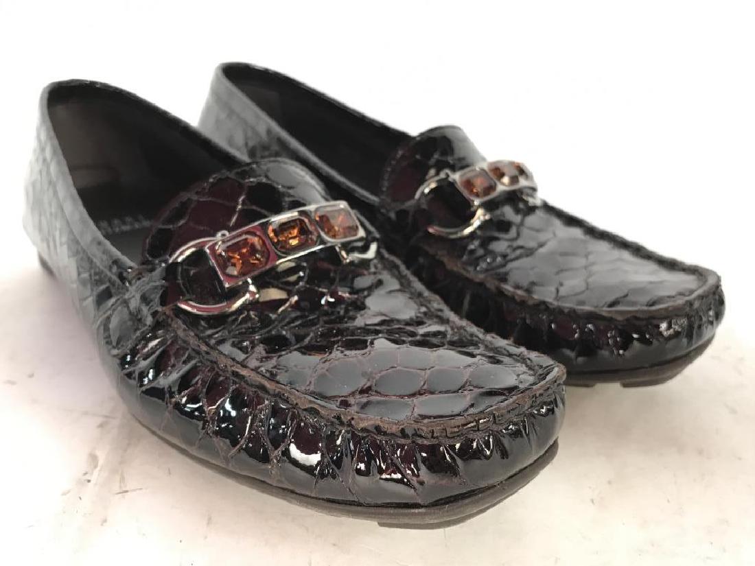 Pair Black Cherry Toned STUART WEITZMAN Moccasins: Soles of Moccasins read STUART WEITZMAN. Moccasins are size 6. Each has Amber and silver toned shoe ornaments. Underside reads MADE IN SPAIN. Includes original box. Women’s shoes, women’s moccasin