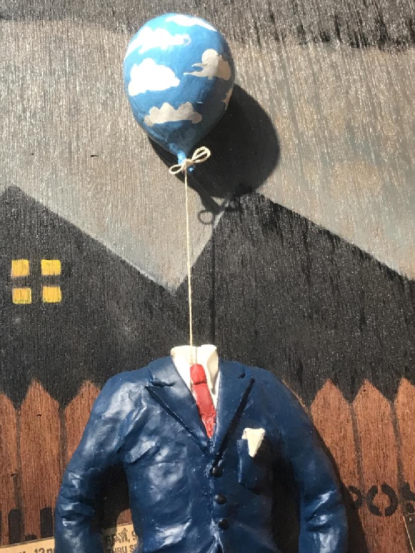 Signed Balloon Man in Shadowbox Artwork: Signed balloon man in shadow box artwork. Signed illegibly in lower right corner, possibly reads ‘Y.NYC.79.’ Art depicts sculptural figure with balloon head with painted and collagen background. A