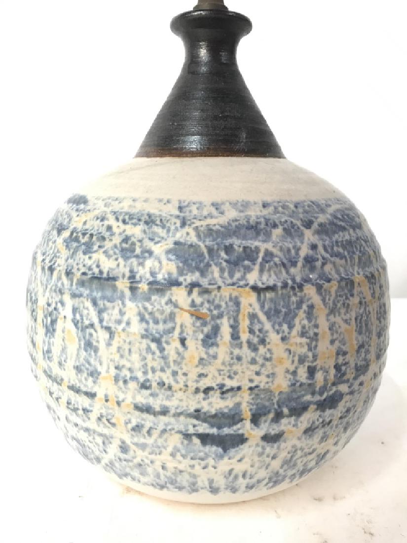 Spherical Shaped Ceramic Lamp: Lamp base is ceramic. Contains tones of blue and slate. Lamp base is spherical shaped. Measures approx 20 inches tall 7 inches wide. table lamp, home accessory, home decor, lighting accessory 6
