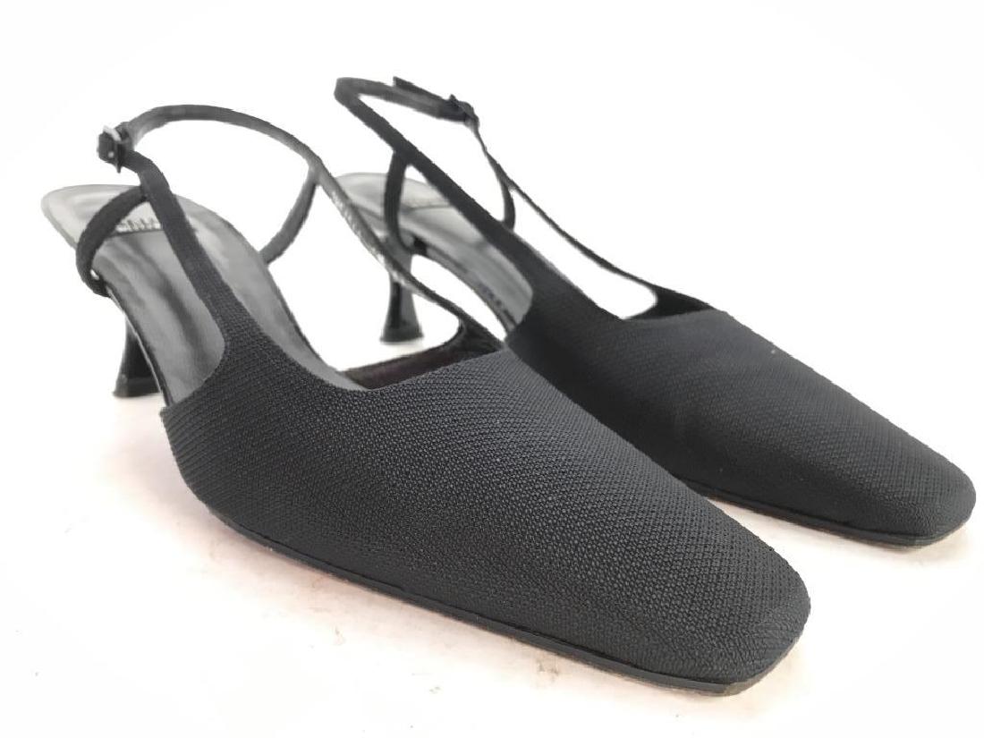 Pair STUART WEITZMAN Women’s Heels: Sole of shoe’s tag reads STUART WEITZMAN. HEELS appear to be 2 inches tall. Shoes are size 9. Shoes are black toned, soles are faux leather. Shoes have some wear. Fashion accessory, wearable, design