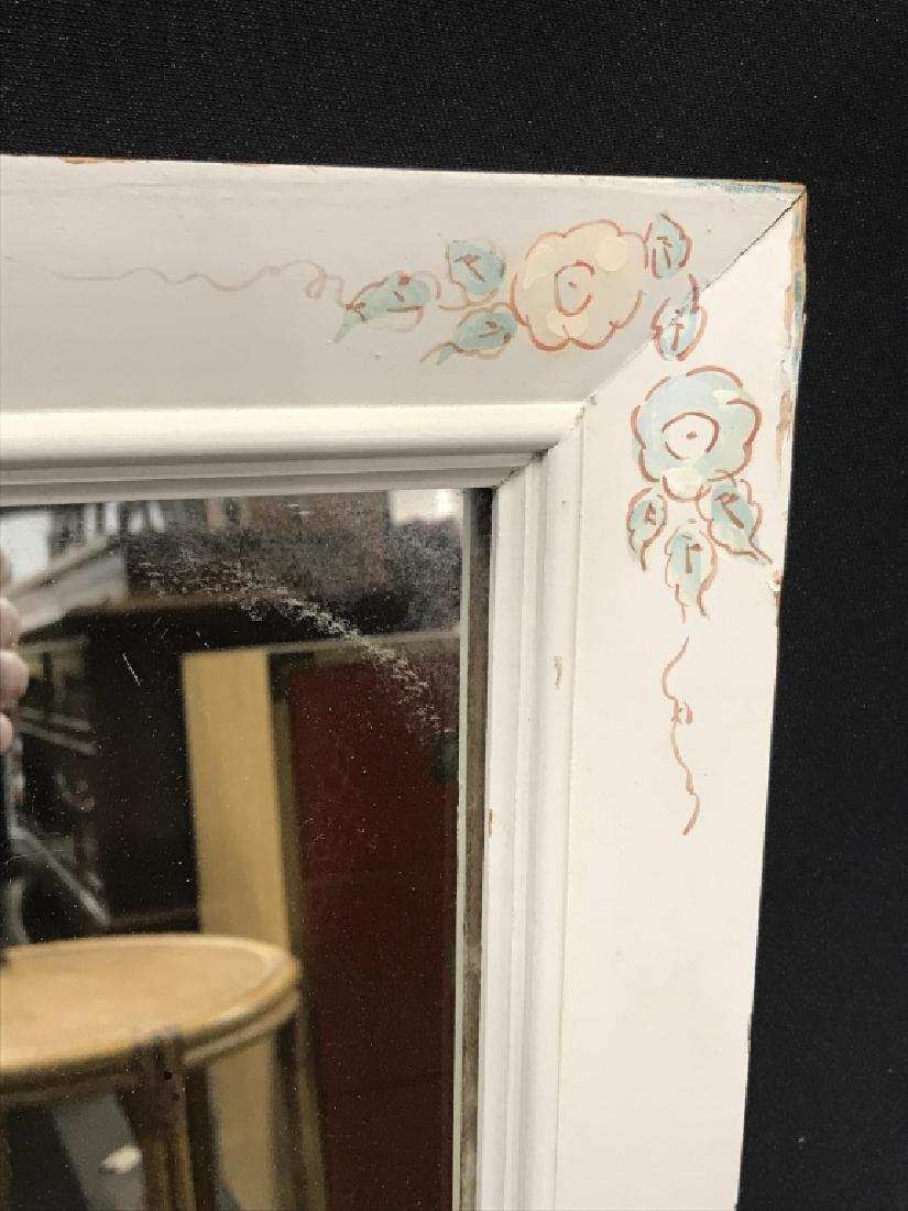 Mirror in Painted Wood Frame W Floral Details: Mirror in painted wood frame with painted floral details. Measures approx 33 inches in height by 25 inches in width. Some surface wear of frame and minor blemish on mirror. Interior home decor, countr