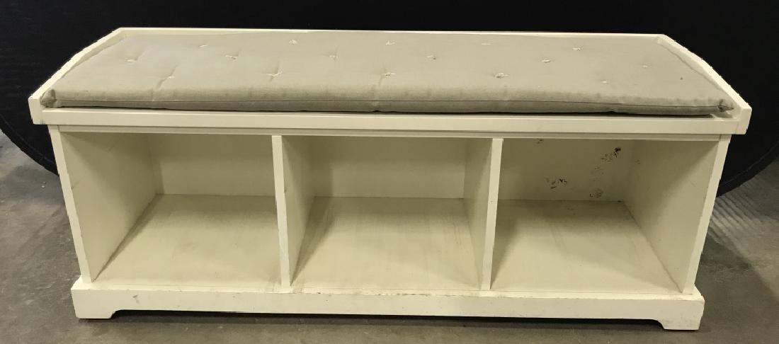 Cushioned Storage Entryway Bench: Cushioned storage bench for entryway / hallway / under window. Bench is wood with removable cushion and has three compartments for storage and organization. Pale, almost white, grey green in tone. Mea