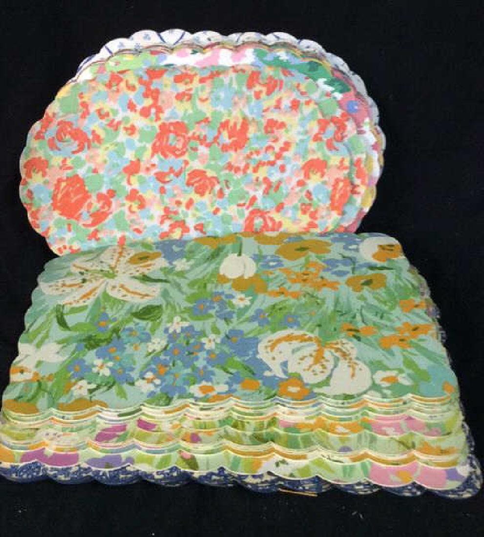 Group Lot of Vinyl place mats: Group Lot of Vinyl place mats. Scalloped edge design and floral patterns, some various degrees of surface wear. Tableware, place settings, tabletop accessory, largest measures approx 18 in by 12 in. 4