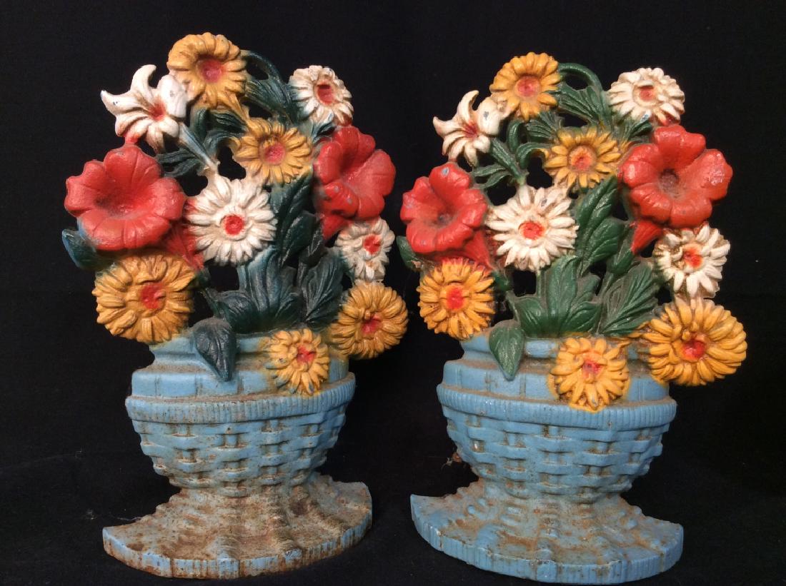 Pair Cast Iron Door Stops, Floral Bouquet: Pair Cast Iron Door Stops, Floral Bouquet. Painted cast iron doorstops, home accessory, home decor. Measures approx 10 in by 5 in by 3 in. 4