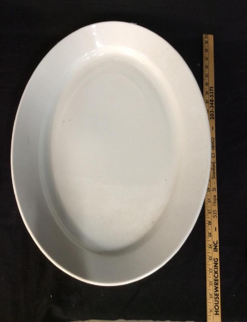 Pair monumental Arabia Porcelain platters, Finland: Pair monumental Arabia Porcelain platters, Finland White toned porcelain centerpiece platters, oval. With some surface wear. Marked on underside for Arabia, made in Finland DD. Measures approx 24 in b