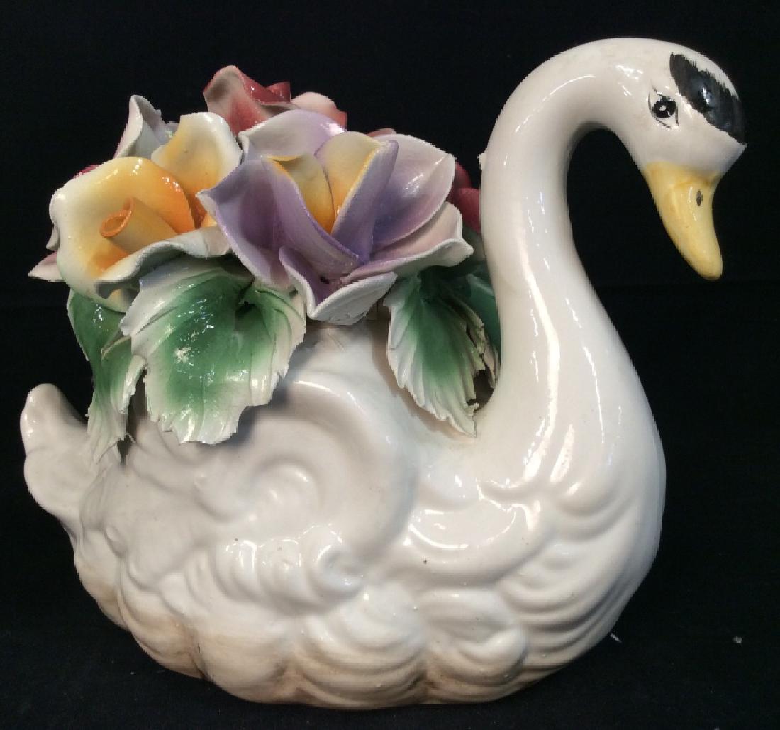 Capodimonte Swan figural Centerpiece, Italy: Capodimonte Swan figural Centerpiece, Italy. Collectible porcelain swan Figural with sculpted flower design. Marked on underside CAPODIMONTE Made in Italy. Centerpiece, tableware, shelf piece, shelf d