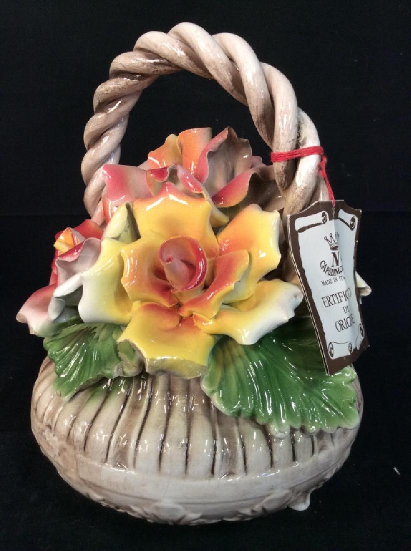Capodimonte Flower Basket, Italy.: Capodimonte Flower Basket, Italy. W certificate on authenticity tag. Collectible porcelain basket with sculpted flower design. Measures approx 10 in by 8 in. Marked on underside CAPODIMONTE Made in It