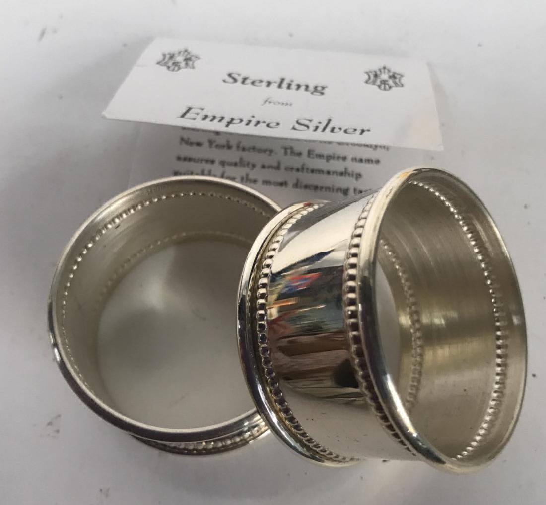 Boxed Set Two Sterling Silver Napkin Rings: Boxed set sterling silver napkin rings, each monogrammed, card reads Empire Silver Company Brooklyn, New York, each measures diameter 2 inches width 1 inch, napkin rings, tableware, tabletop accessory