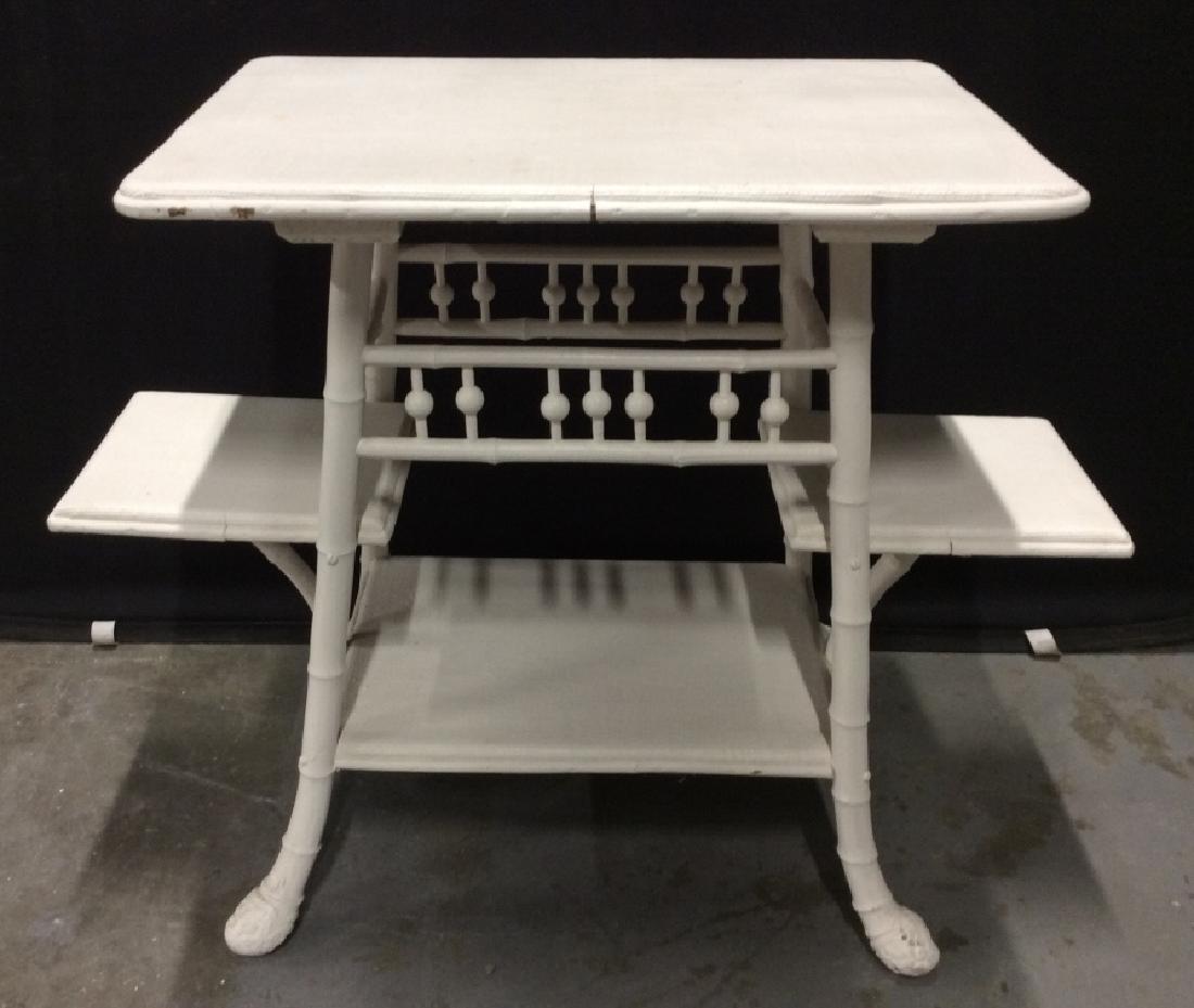 Vintage Multi-Tiered Side Table: Vintage painted bamboo and wood side table with 4 surfaces for display / storage. Side table is off white in tone. Some minor surface wear. Measures approx 27.25 inches in height by 34.5 inches in wid