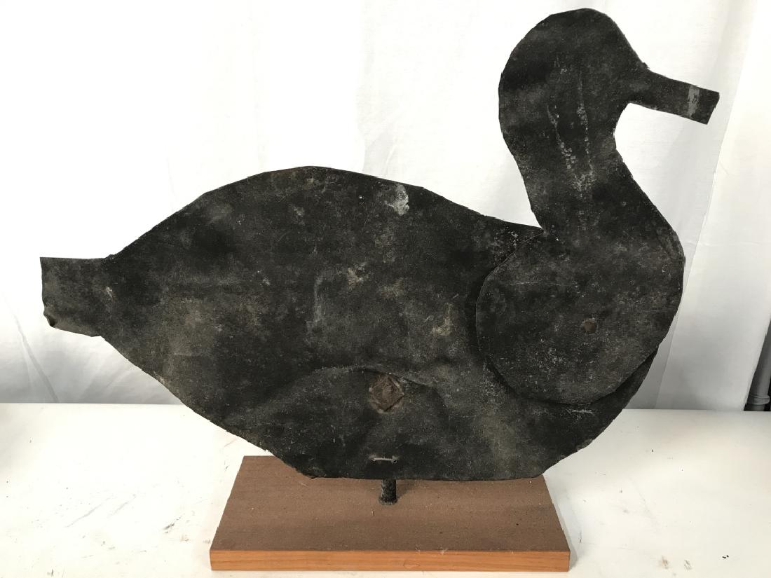 Metal Duck Sculpture W Wooden Base: Sculpture is black toned and metal. Base is beige toned and wooden. Head of duck is articulated, animal / bird statuary, garden sculpture, indoor outdoor, home accent, rustic farmhouse decor Measures 