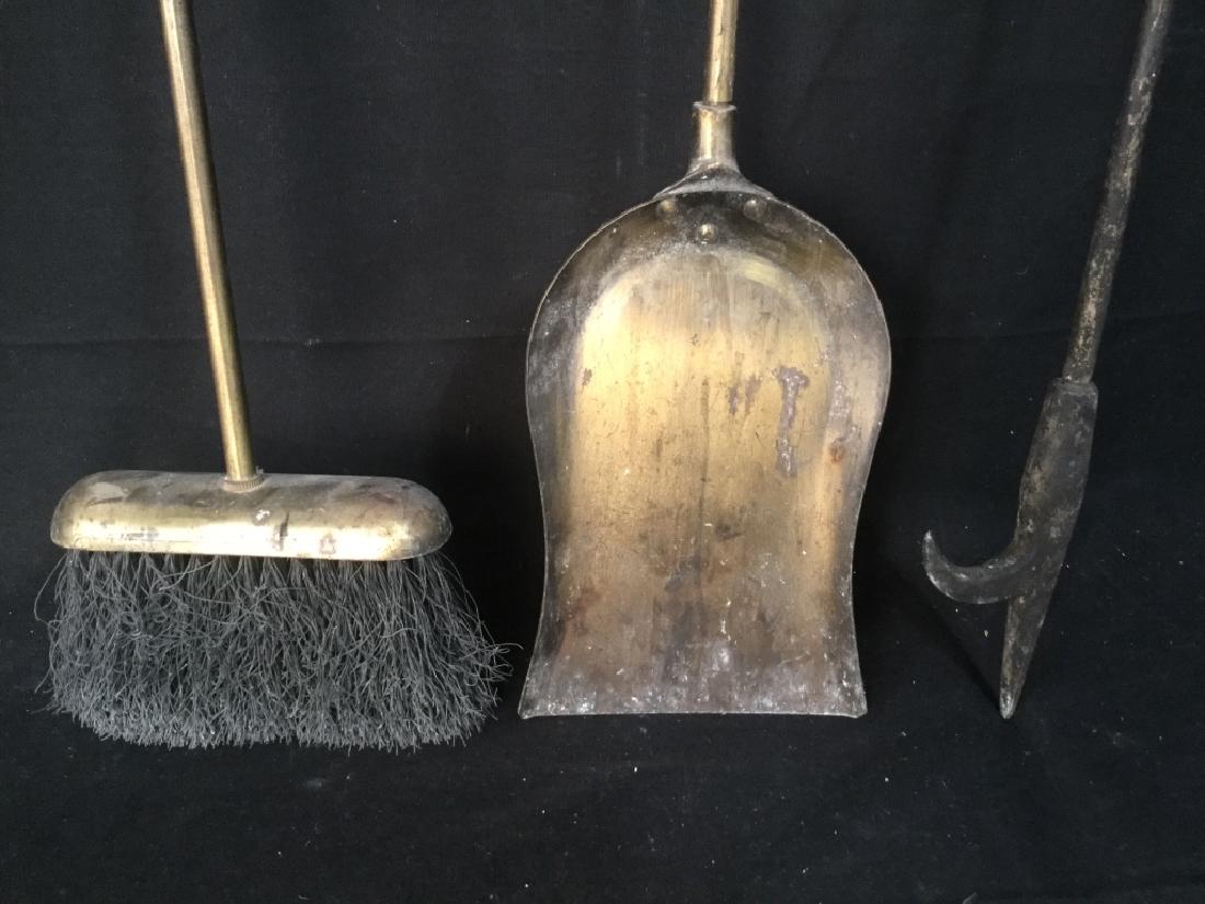 Brass Metal Fireplace Tools W Stand: Brass metal fireplace tools with stand. Tools include a brush, shovel, and poker. Measures approx 29 inches in height by 9.75 inches in width by 6.75 inches in depth. Brass metal fireplace tools, fire