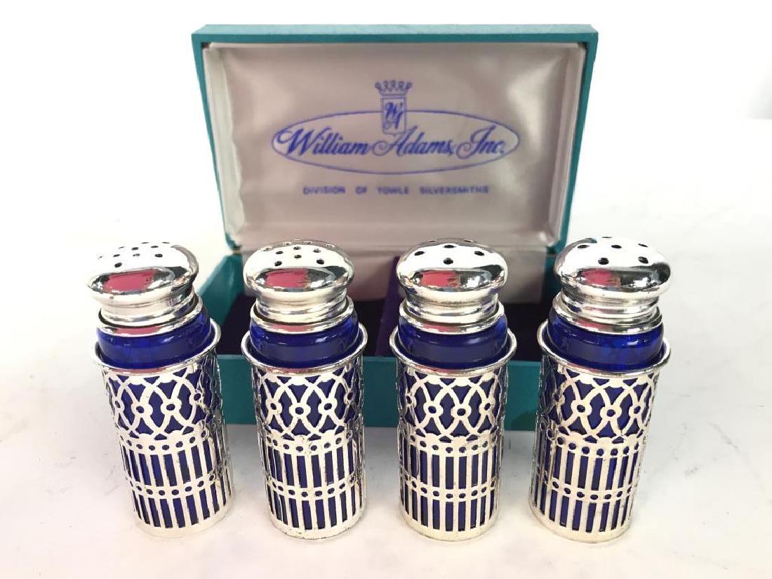 LOT 4 WILLIAM ADAMS INC Salt & Pepper Shakers: Lot includes 4 silver & blue toned Salt & Pepper Shakers And Box which reads WILLIAM ADAMS INC. Box measures approx 5 inches long 3 inches deep. tbaleware, tabletop accessory 6.