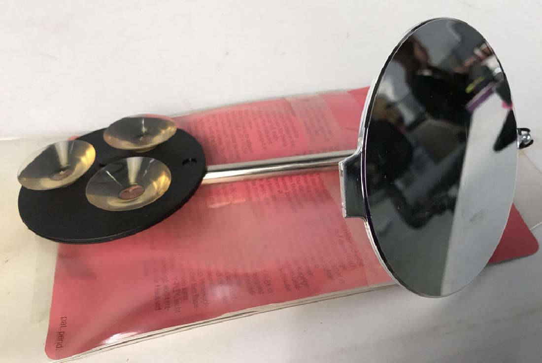 BEAUTY Flex Unbreakable Magnifying Mirror: BEAUTY Flex Unbreakable Magnifying Mirror, 9 in x 5 in, in original slip package, likely unused, A Swiss made Gadget that attaches to the bathroom mirror and has telescope extender for better looking,