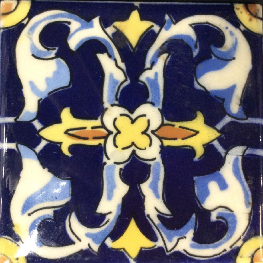 IDEAL STANDARD Porcelain Tile: Decorative tile, marked on reverse IDEAL STANDARD MEXICO, curling filigree designs in tones of deep blues, sky blues, yellows and raw sienna. Measures approx 4 1/2 in by 4 1/2 in, home accent, Tile, W