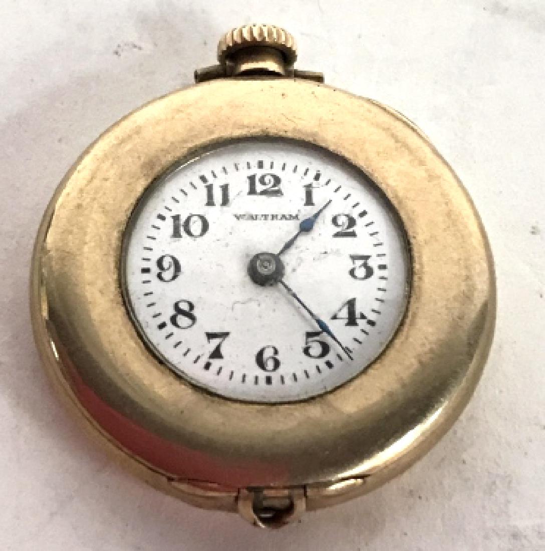 Lot 8 Assorted Watch Lot: Lot includes 1 rectangle face watch, 1 double face watch, 1 Tissot watch, 1 Lorus Mickey Mouse Watch, 1 Waltram Watch, 1 Montauk Watch, & 1 locket watch. Only 2 watches have wristbands. Longest piece