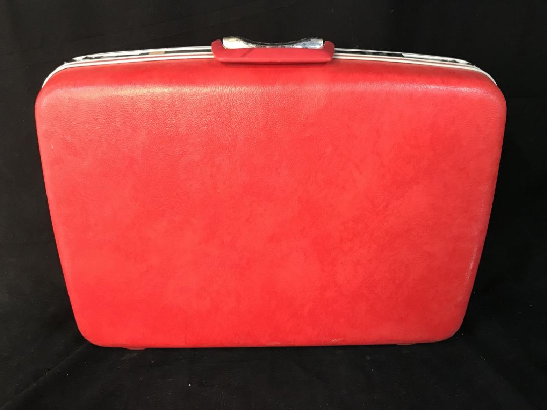 Vintage Samsonite Silhouette Red Suitcase: Vintage Samsonite Siloughette Red Suitcase with polka dot interior, measures approximately 22 inches long x 17 inches tall x 7 inches deep, some scuffs and a few stickers to exterior, interior in very