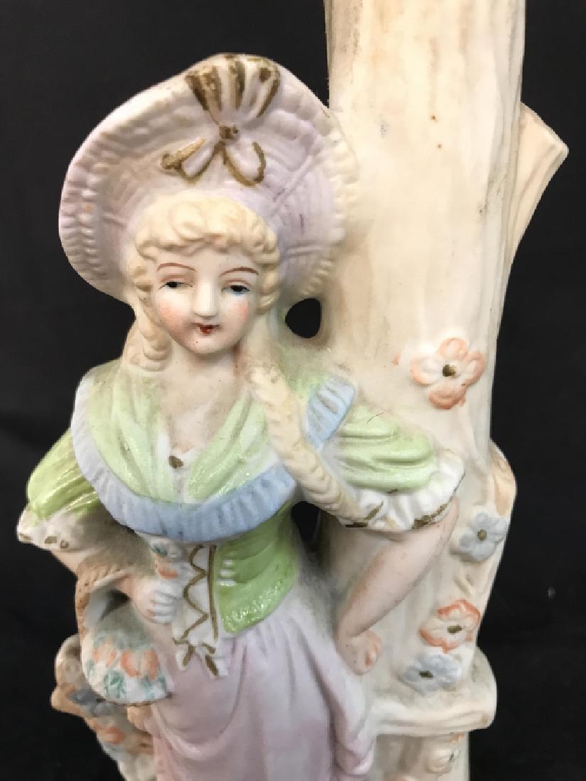 Porcelain Lamp W Female Figure: Piece is porcelain. Depicts female figure standing next to a tree. Measures approx 13 inches tall 4.5 inches wide. Table lamp, home lighting, home accessory 6