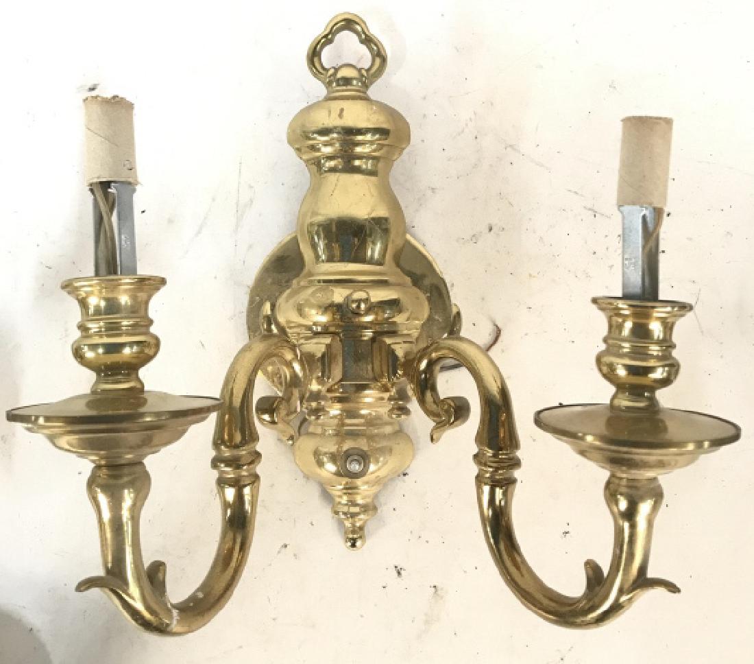 Lot 3 Brass Candelabra Wall Sconce Lights: Each sconce Light has 2 s curve detailed arms. Each piece is gold toned and brass. Each measures approx 13 inches tall 12 inches wide, 8 inches deep. light fixtures, lighting accessories, home accent,