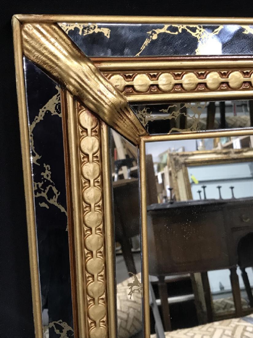 J.A. Olson Mirror Within Mirrored Frame: Mirror is set in double handed mirrored frame with gold tone detailing. Verso is marked for J.A. Olson Company. Measures approx 43.25 inches in height by 31.2 inches in width. Interior home decor, sta