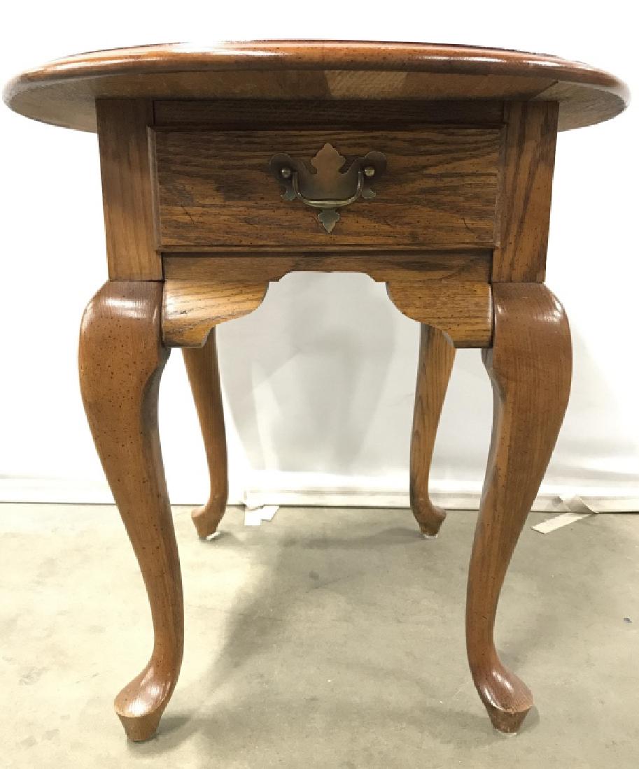 LENOIR HOUSE Carved Wooden Side Table: Tag on inside of drawer reads LENOIR HOUSE DIVISION OF BROYHILL FURNITURE IND INC. Side Table is wooden with 4 cabriole style legs. Contains one drawer with gold toned metal handle. Measures approx 23
