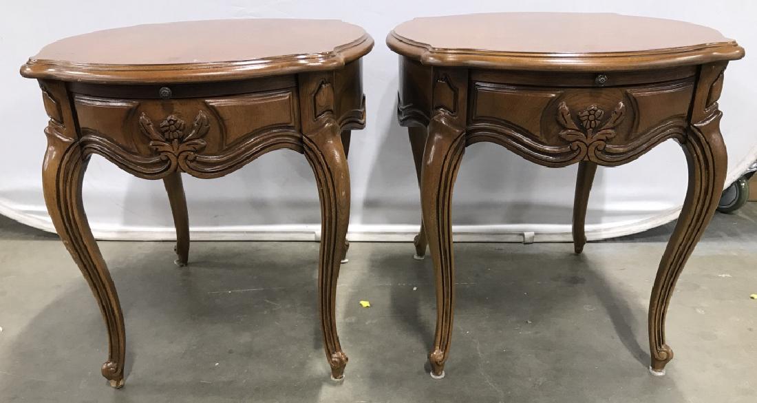 Pair THOMASVILLE Carved Wooden Side Tables: Tag on underside of tabletop reads THOMASVILLE. Pieces have intricately carved Wooden detail. Each piece has beige tone. Each measures approx 22 inches tall and wide 27 inches deep. Each piece has pul