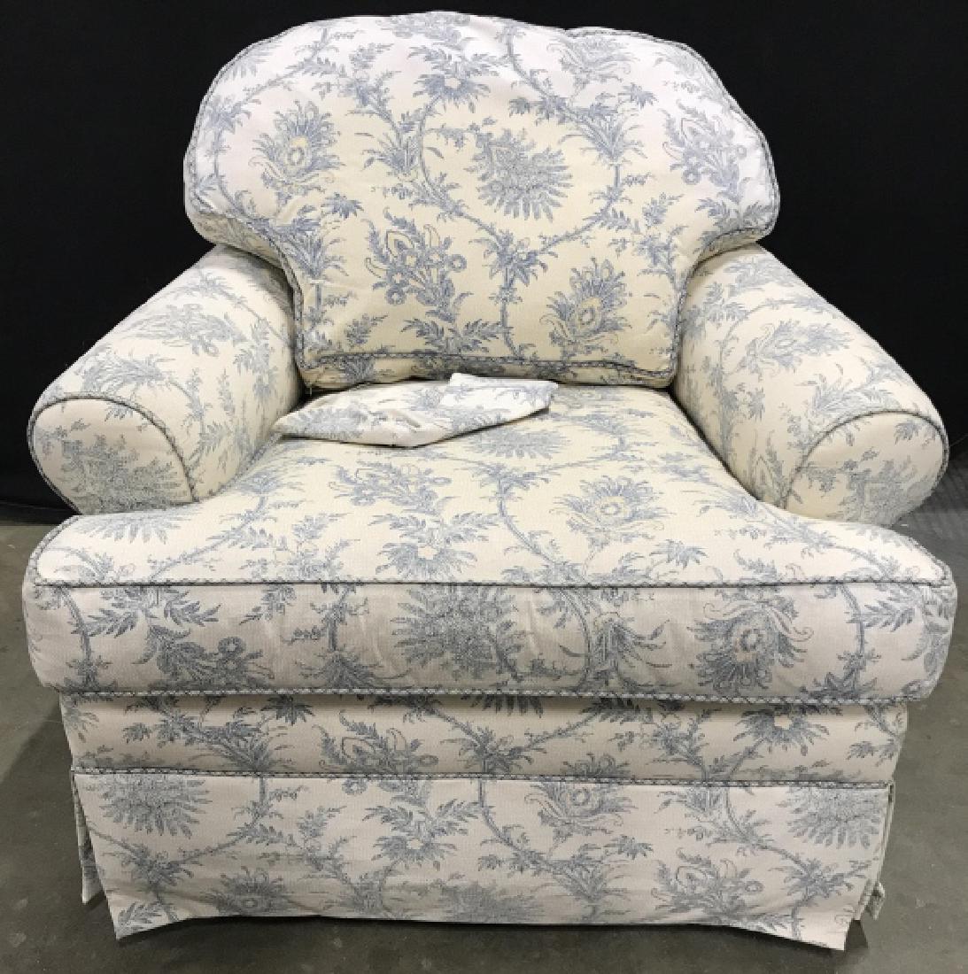 ETHAN ALLEN Floral Detailed Skirted Armchair: Tag underneath cushion reads ETHAN ALLEN. Chair is Skirted. Contains light yellow and teal toned. Upholstery has floral, leaf, and vine detail. Measures approx 36 inches wide 34 inches deep & tall. Co