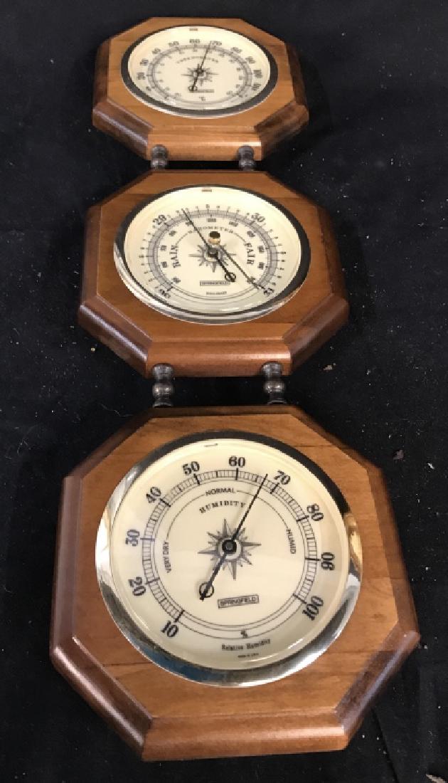 Wall Mount Wood Glass Barometer: Three measuring systems include thermometer, Barometer, and humidity, Wall Mount gauges, measures ht app 20 inches by 6.5 inches, marked for Springfield, marked for Made in USA