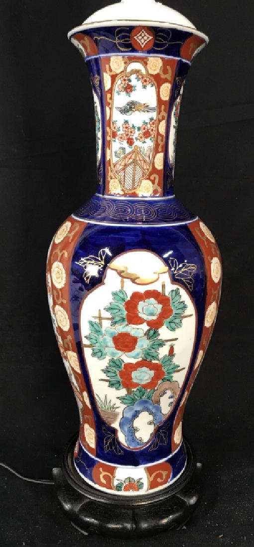 Asian Porcelain Lamp, Hong Kong: Marked for Made in Hong Kong, Asian Porcelain Lamp In vase shape, wood base, measures app ht 34 inches to finial, Asian decorative accessories