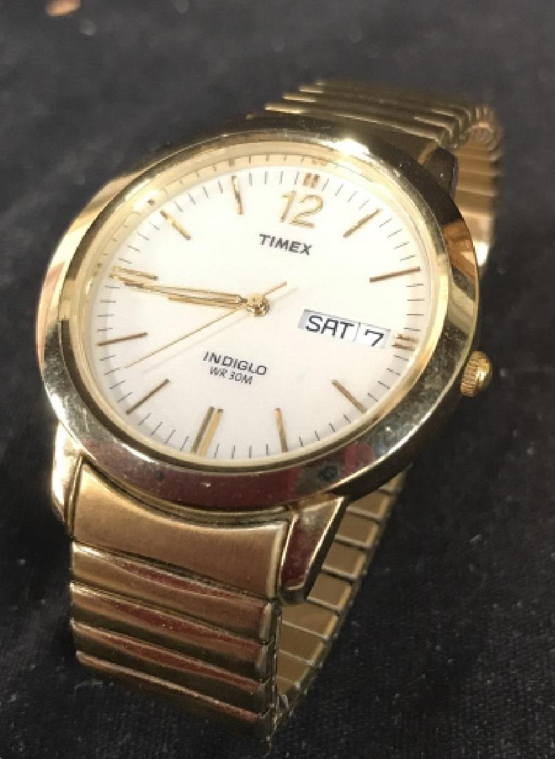 Gold Toned Band TIMEX Wristwatch: Face measures app 1.5 inch diameter, band app diameter 2.5 inches, marked Timex, Indiglo WR 30M,