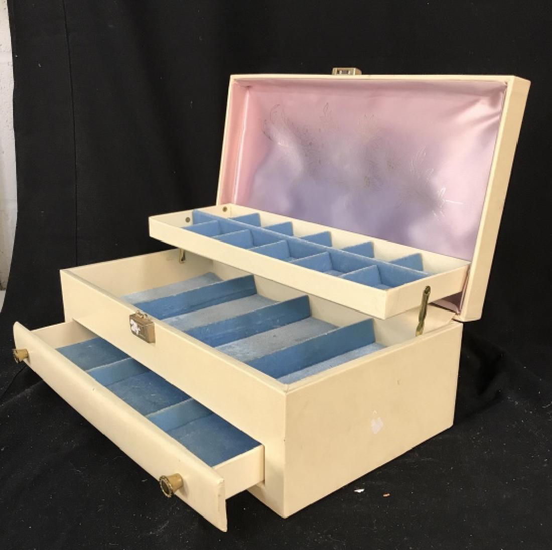 Vintage White Poss Leather 3 Shelf Jewelry Box: With blue velvet interior, , compartmentalized, pull out drawer and pop up shelf, closed measures top app 15 by 9 inches ht app 5.5 inches, has surface wear and losses, marked for Lady Buxton