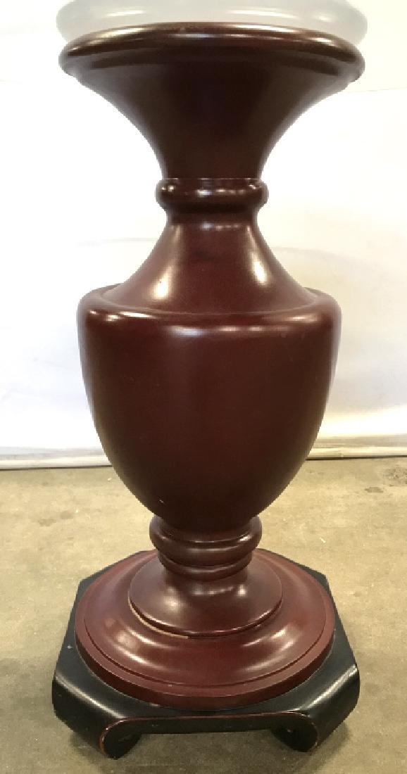 Circular Glass Topped Table W Asian Style Base: Circular Glass Topped Table W Red And Black Toned Asian Style Base, Measures approx 25 inches tall x 24 inches in diameter, some minor scratches scratches to top. Lamp table, occasional table, drinks 