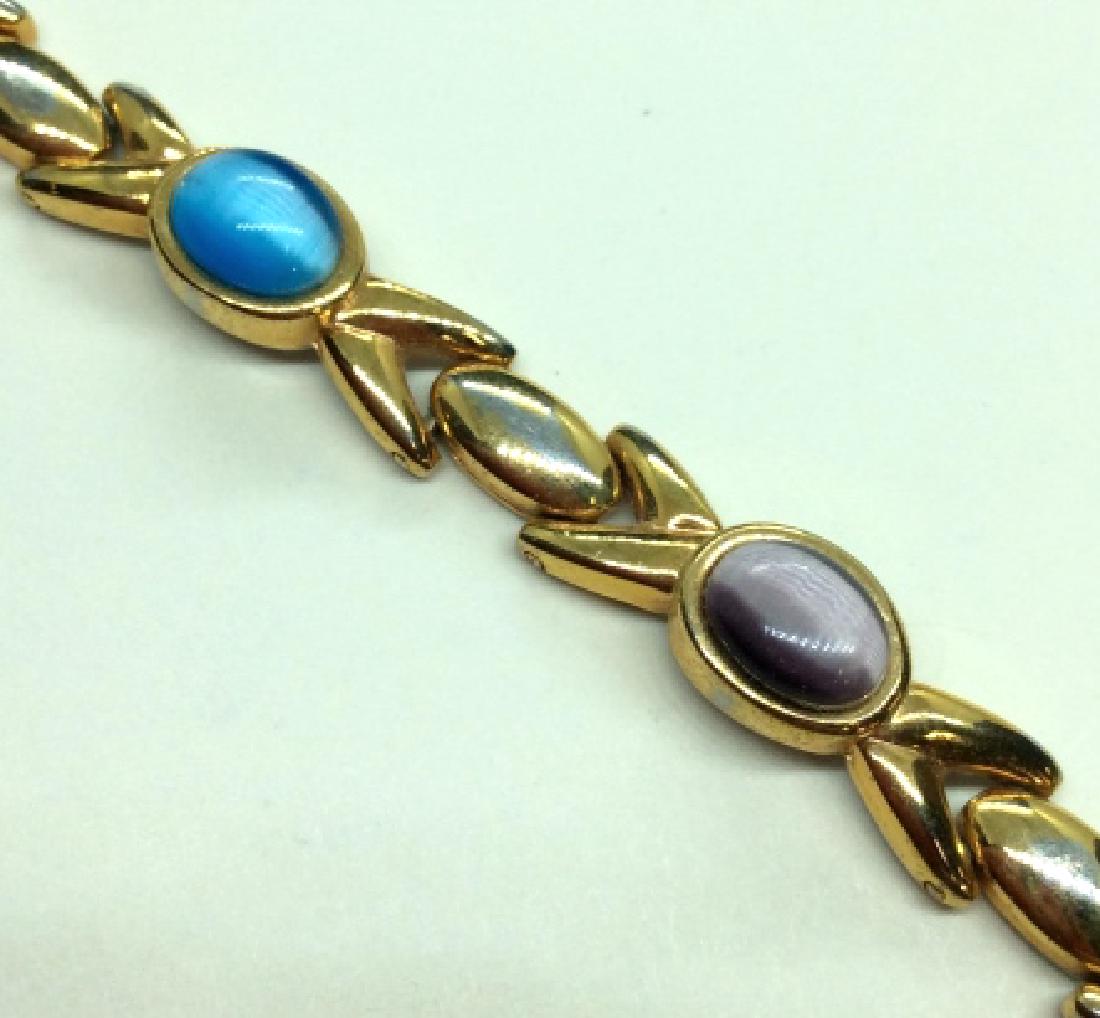 Gold Toned Metal X Link Bracelets w Cabochons: Gold toned metal, x Link Tennis Bracelet, with cabochons, possibly various natural stones, Measures approx 8in long when laid flat. Women’s vintage costume estate jewelry, fashion accessories, weara