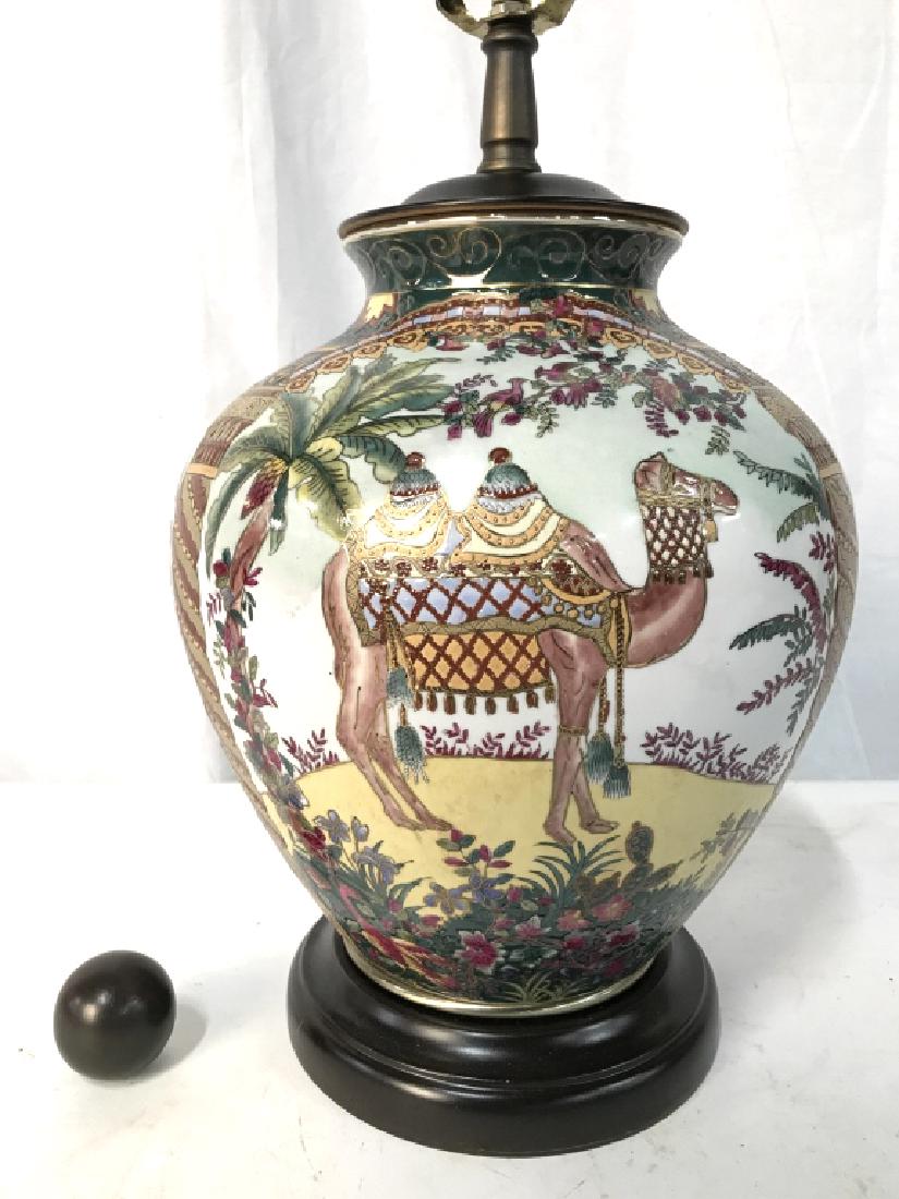 Painted Asian Ceramic Table Lamp With Camel Motif: Painted Asian Ceramic Table Lamp With Camel Motif, includes finial, measures approximately 27 inches tall x 10 inches in diameter, not tested, minor scratch to base. Table Lamp, Reading Lamp, Bedside 