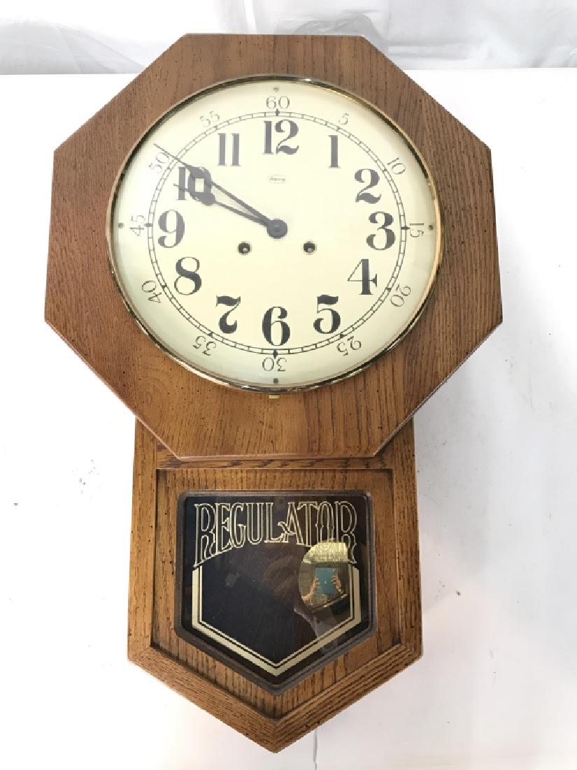 Vintage Ridgeway Regulator Wall Clock Vintage Ridgeway: Vintage Ridgeway Regulator Wall Clock in Oak Toned Wooden Case, measures approximately 24.5 inches long x 15.5 inches wide x 5.5 inches deep, not tested. Wall Clock, Vintage Clock, School House Clock.