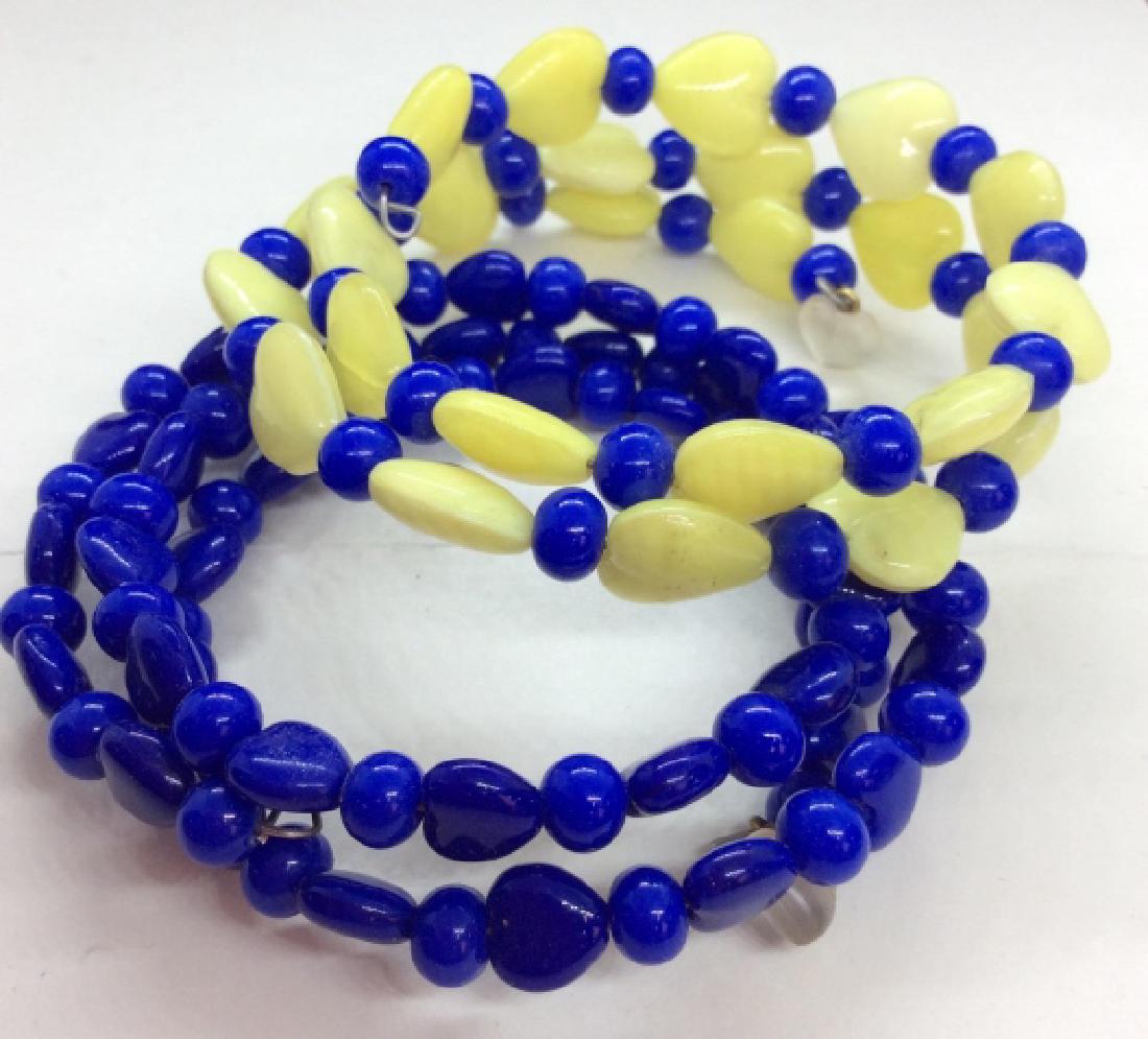 Glass Beaded Wrap Around Bracelets Yellow toned glass: Yellow toned glass heart beads with blue toned glass beads, measures app 3 in in diameter, women’s vintage costume estate jewelry, fashion accessories, decorative wearable accessory. 4
