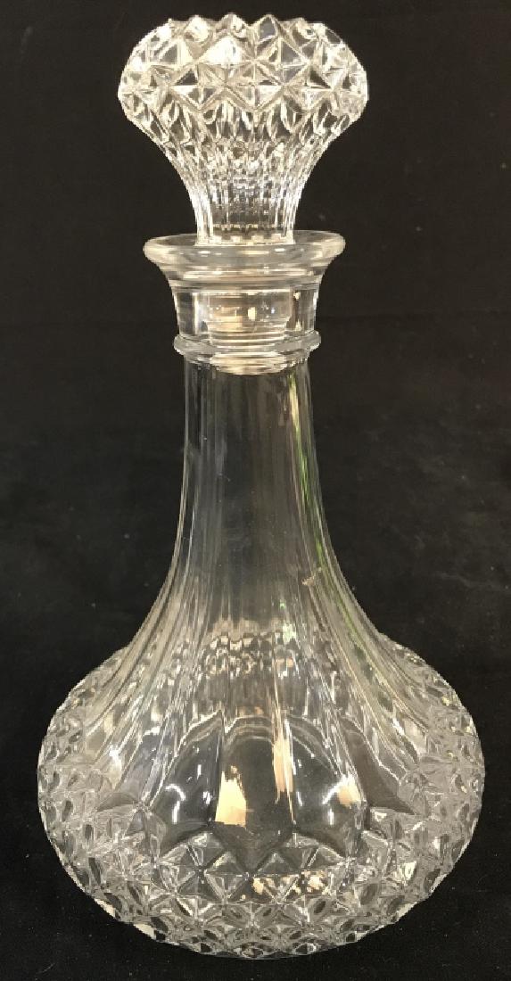 Cut Glass Ships Decanter & Stopper: Decanter includes stopper. Piece is narrow at top and wide at base. Measures approx 10 inches tall 6 inches wide. ships decanter, bar ware, drinking accessory, tableware 6.