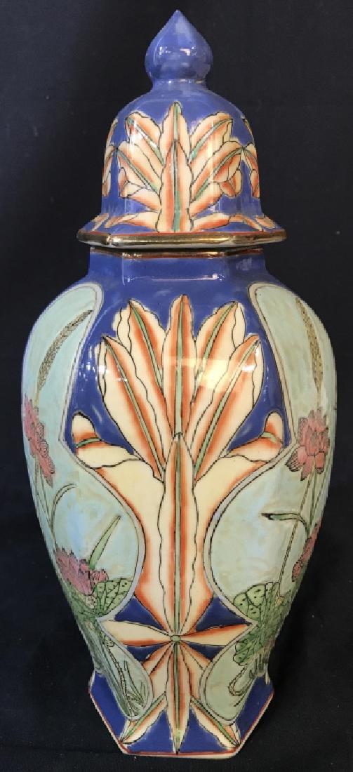Painted Ceramic Asian Ginger Jar: Piece contains Asian Characters on underside. Piece is porcelain. Contains multi toned painted floral detail. Jar includes lid measures approx 12.5 inches tall 5.5 inches wide. Chinoiserie, Orientalia