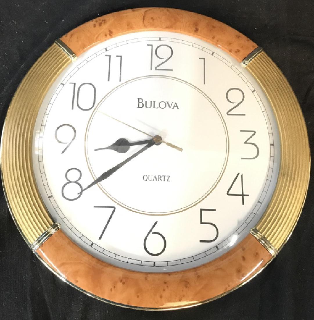 BULOVA Wall Clock: Reads BULOVA on clock face. Clock frame is gold & beige toned. Measures approx 11.5inches diameter. home decor, wall clock, home accent, 6.