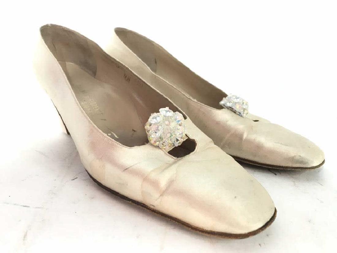 EUGENIA OF FLORENCE BY TINA Women’s Heels: Inside of shoes read EUGENIA OF FLORENCE BY TINA Made In Italy. Heels appear to be 2 inches tall. Has faux shoe ornament near toe. Shoes are light tan toned. Shoes have some wear. Size 8.5, fashion ac