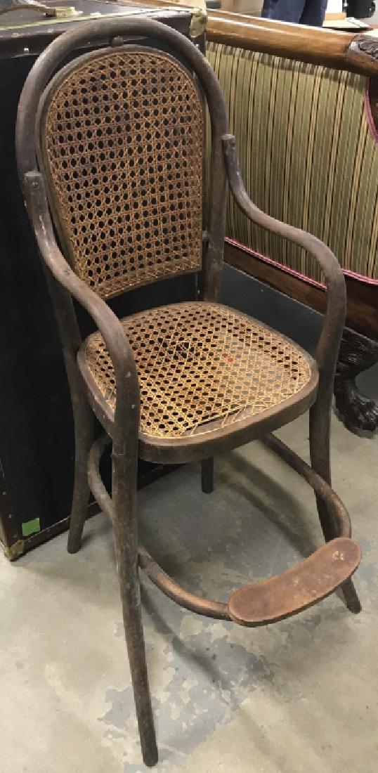 Antique Wood And Caned High Chair: Bentwood arms frame and foot rest, Caned Back And Seat, antique child's / dolls table, children's highchair, Chair Measures ht 38 inches width app 14 inches, depth to foot rest app 19 inches