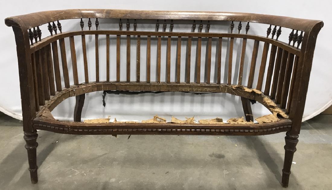 Vintage Antique Carved Wooden Bench Frame: Piece is vintage possibly antique. Contains carved wooden detail. Piece has 4 legs. Measures approx 44 inches long 27 inches tall 23 inches deep. Piece has evident scratches, portion of one armrest is
