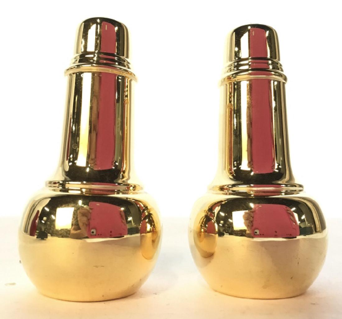 Lot 2 Gold Toned Salt & Pepper Shakers: Lot includes 1 Salt & 1 Pepper Shaker. Shakers are gold toned and metal. Each measures approx 4.5 inches tall 2 inches wide. Tableware, tabletop accessory, salt and pepper shakers 6